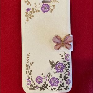 White cell phone case with purple flowers and purple magnetic butterfly clasp